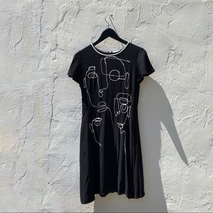 Fitted flowy black mid length dress